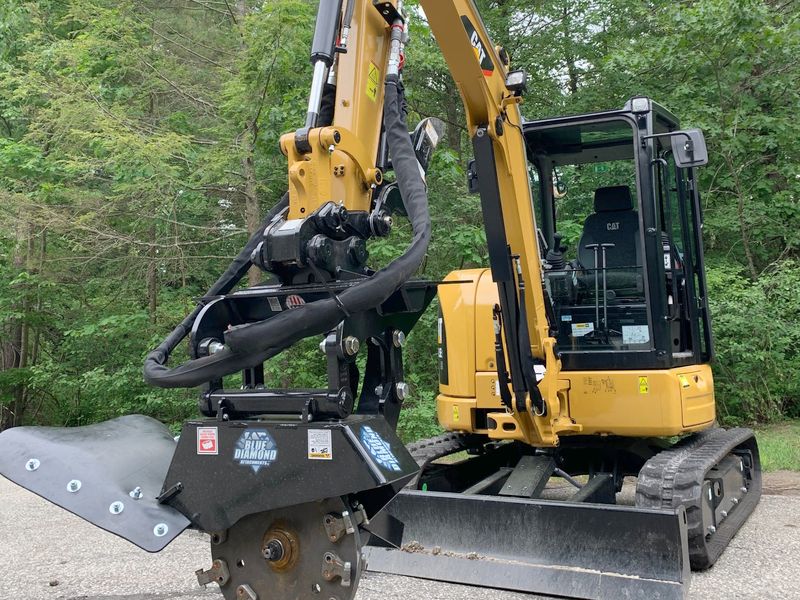 Blue Diamond stump grinder head on the mini excavator
